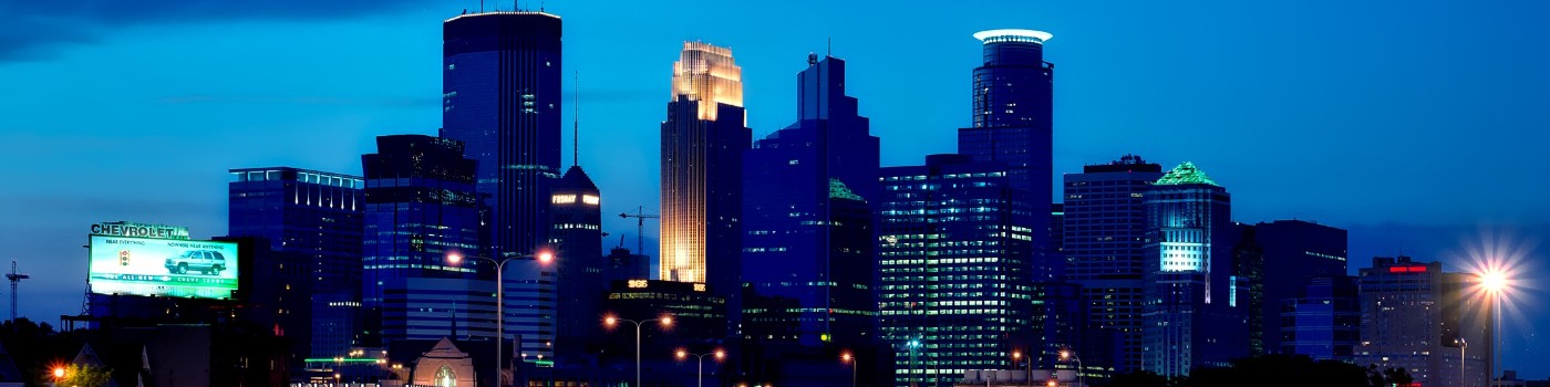 A photo of the downtown Minneapolis skyline, at dusk.